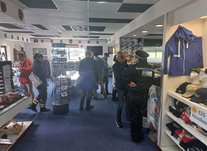 Having cleared immigration, crew members shopped at the Post Office and Tourism Centre