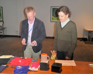 Roger Price and Julia Frater selecting raffle prizes