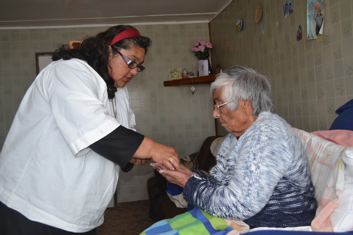 Ellen Rogers receiving Holy Communion on her 100th birthday.
