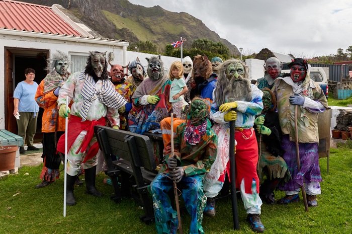 Rita Repetto watches the Okololies pose with Emily Swain.