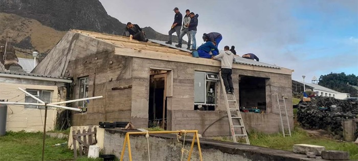 Fitting roofing sheets