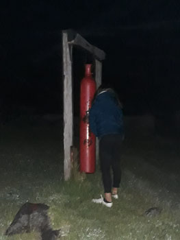 Emma Nolan striking the fishing gong