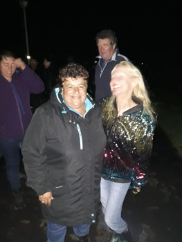 Jill Repetto near the gong with Marina and Sean Burns