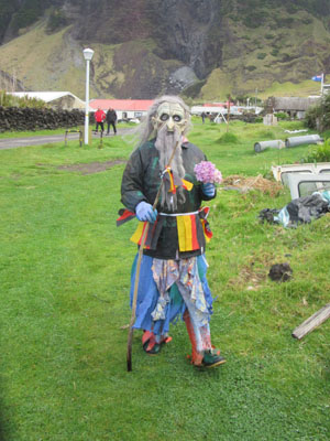 Okalolie with Hydrangea head approaching the Residency's side gate