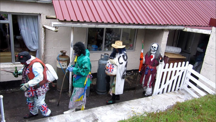 Marching out of the Residency to the back wall, with drinks