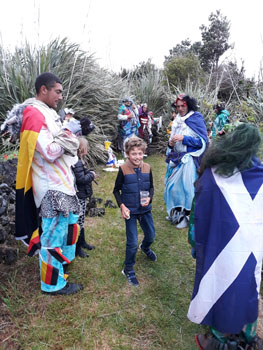 Drinking and eating on the back wall behind the Residency