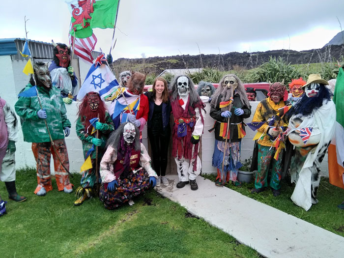 A soaked Emma Nolan posing for a group shot with the Okalolies