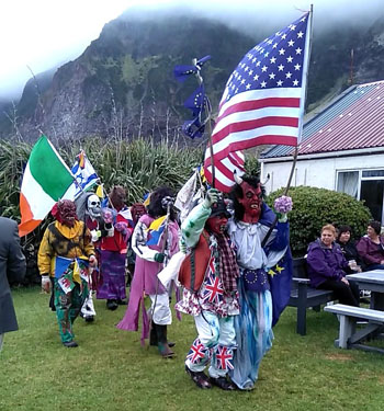 Okalolies making an entrance to the Residency garden for the Admin's reception, to music and being filmed/photographed by Sean