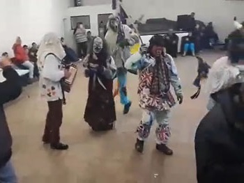 Okalolies entering Prince Philip Hall and jigging around to accordion music