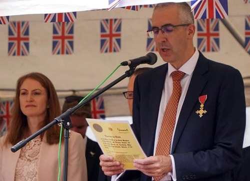 The Chief Secretary and Head of Public Service, Ian Todd OBE, reading the Royal Commission