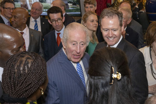 Reception at St James's Palace showing King Charles greeting guests with Chris Carnegy in the back row.(Photo: Commonwealth / Ray Tang)