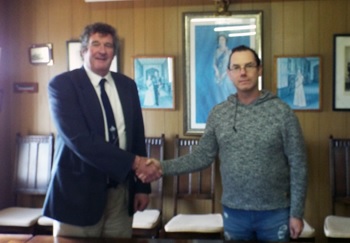 Sean Burns congratulates David Moores on being sworn in as Acting Administrator.
