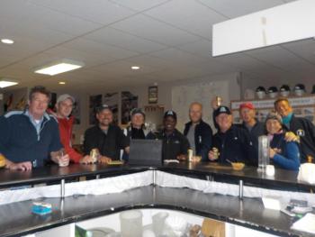 Golfers celebrating at the 19th Hole after the match.