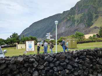 Visitors taking photographs by the famous sign.