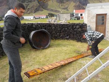 Preparing to place the sign on the wall