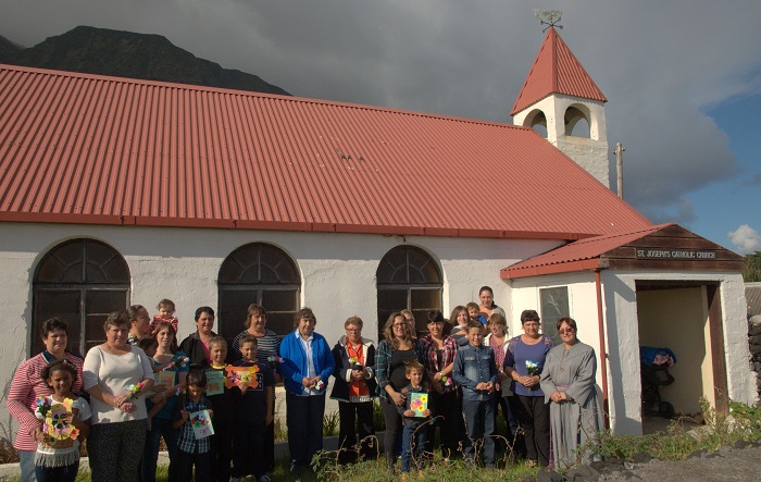 Mothering Sunday- Eucharistic Minister Mrs Anne Green and all mothers standing in the garden of St Joseph's Catholic Church.