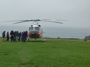 Loading passengers onto the helicopter for return to the Agulhas II.