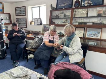Having a go at carding and spinning. Photos: Kelly Green