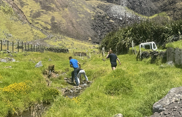 The Vineta's crew negotiating their way across the Big Watron towards the 1961 volcano.