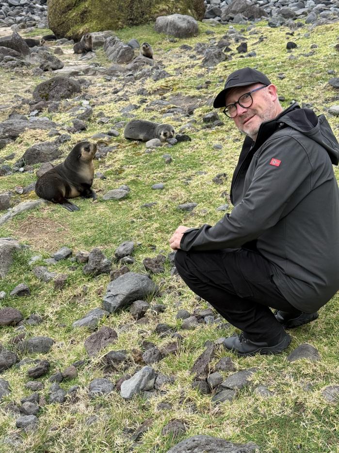 Visiting specialist Rob MacIver with fur seals at Pigbite. How many can you see? Photo: Philip Kendall