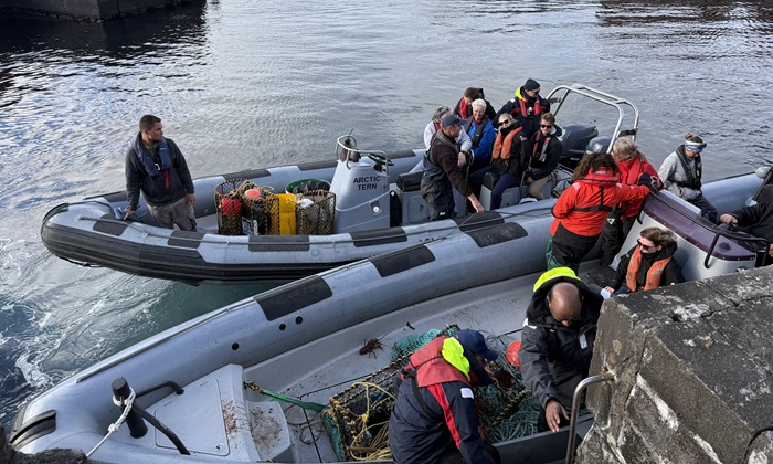 RIBS returned from Nightingale in the harbour with disembarking passengers. Photo: Philip Kendall