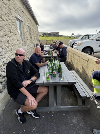 The FV Antarctic Sea's crew outside the Albatross Bar