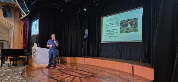 Philip Kendall speaking to passengers on the MV Silver Cloud.