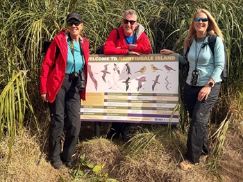 Passengers by the information board on Nightingale, and photographing a nesting Yellow-nosed Albatross. Photo: Philip Kendall
