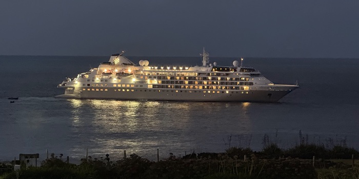 Silver Wind's lights blazing at dusk as the final zodiacs arrive back at the ship. Photo: Philip Kendall