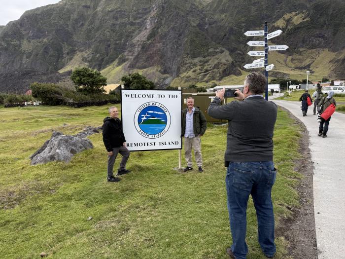 Hondius visitors by the Romotest Island sign. Photo: Philip Kendall