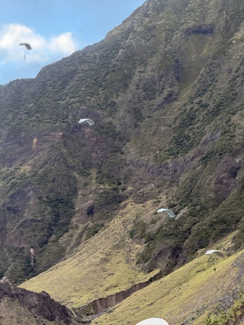 A sight never seen before on Tristan, as parachutists descend into the settlement in front of the 1,500ft cliffs.