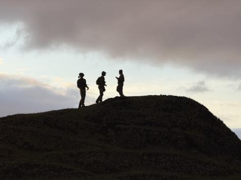 Men of the first group the Patches, where from the top of one of the mounds they guided in the aircraft for cargo drops. Photo: Philip Kendall