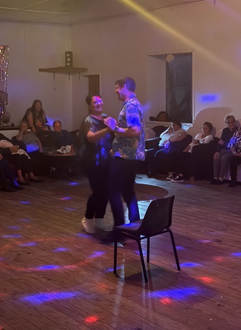A quick dance around before the next change of partner in the Chair Dance.