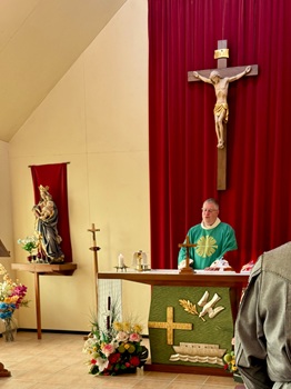 Fr. Dominic Helmboldt celebrating mass in St Joseph's church.