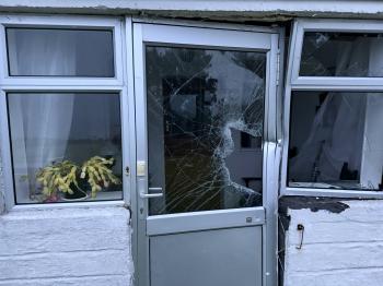 The Residency's front door and living room windows were broken by the flying longboat. The longboat was itself badly cracked with bits torn off.
