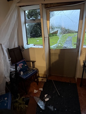 The smashed Residency door from the inside, and later temporary repairs.