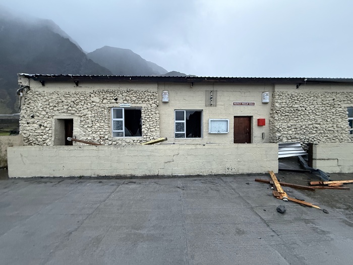 Flying debris from one of the houses broke windows at the Albatross Bar and damaged the interior. The broken windows have since been temporarily boarded over.