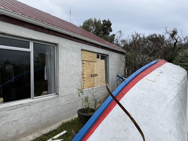 Boarded up windows at the Residency.