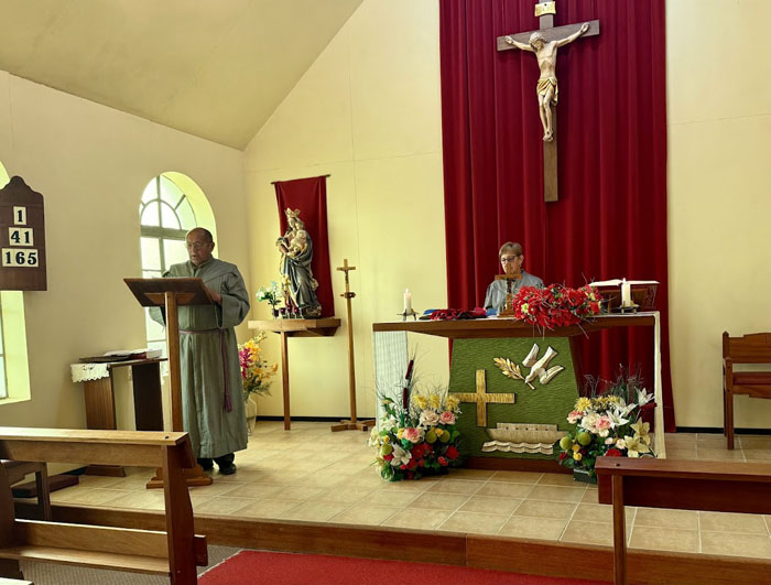 Service at St Joseph's Church:

      Lay Ministers Dereck Rogers (at the lectern) and Anne Green (behind the altar) during the service