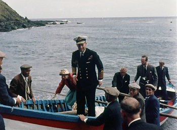 Prince Philip arrives in a longboat