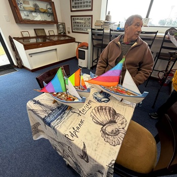 Brian Rogers with some of his model longboats.