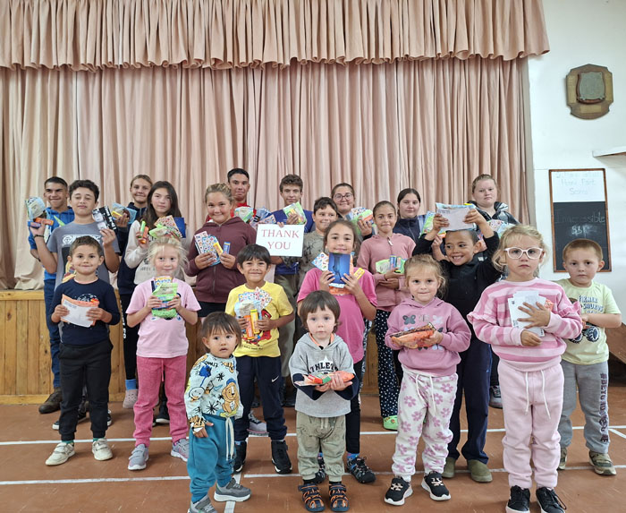 The children with their presents from Mandy and Noel
during a St Mary's School assembly on 31st March.