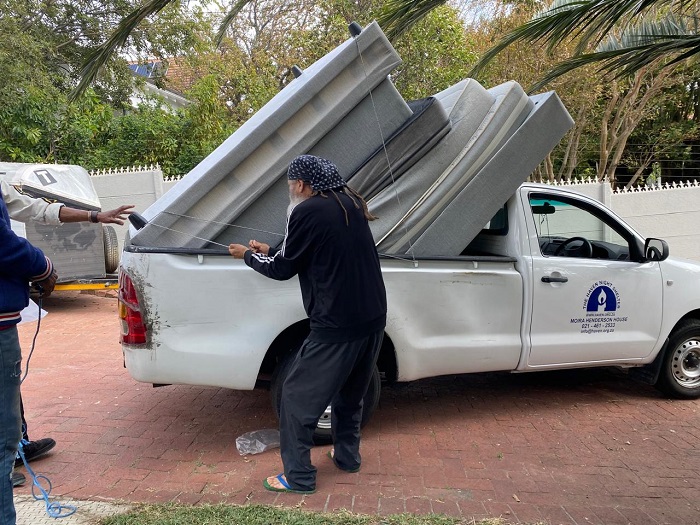 Loading the beds into The Haven's bakkie at Tristan House