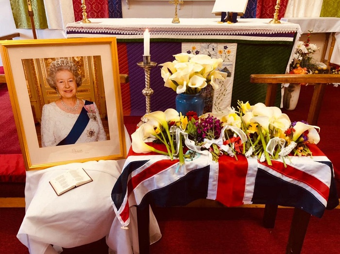 The portrait and flowers placed before the altar in St Mary's Church.