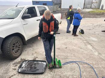 Biosecurity measures: boot washing at Calshot Harbour. Photo: Shannon Swain