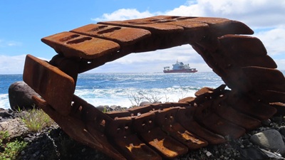 The SA Agulhas II viewed through discarded caterpillar tracks.