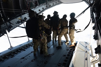 Tandem parachutists lined up and leaving the ramp. Photos: Ministry of Defence