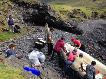 Pulling the dinghy away from the waves.