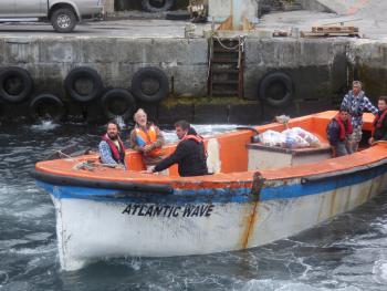 Tony Newling-Ward and his son Nick return to their yacht with supplies