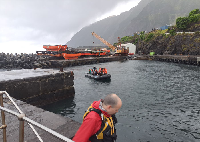 National Geographic Explorer passengers entering the harbour on zodiacs